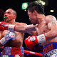 Illustration for article titled Manny Pacquiao Defeats Keith Thurman On Split Decision, Becomes Oldest Welterweight Champion In History